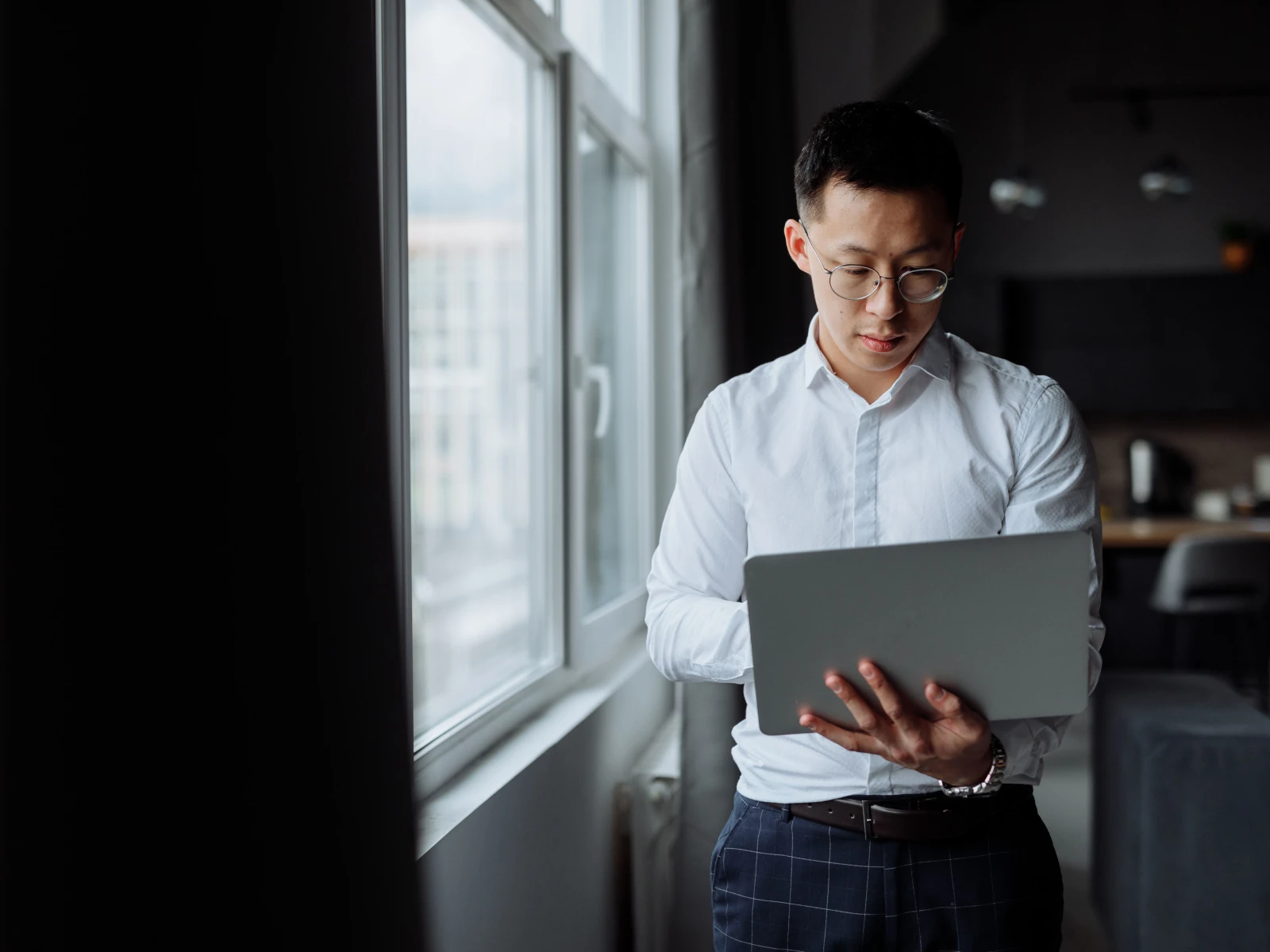 a man holding a laptop