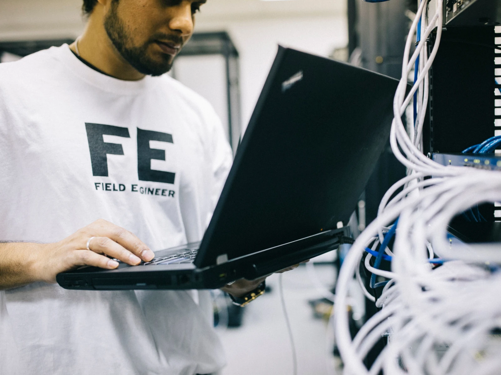 a man holding a laptop