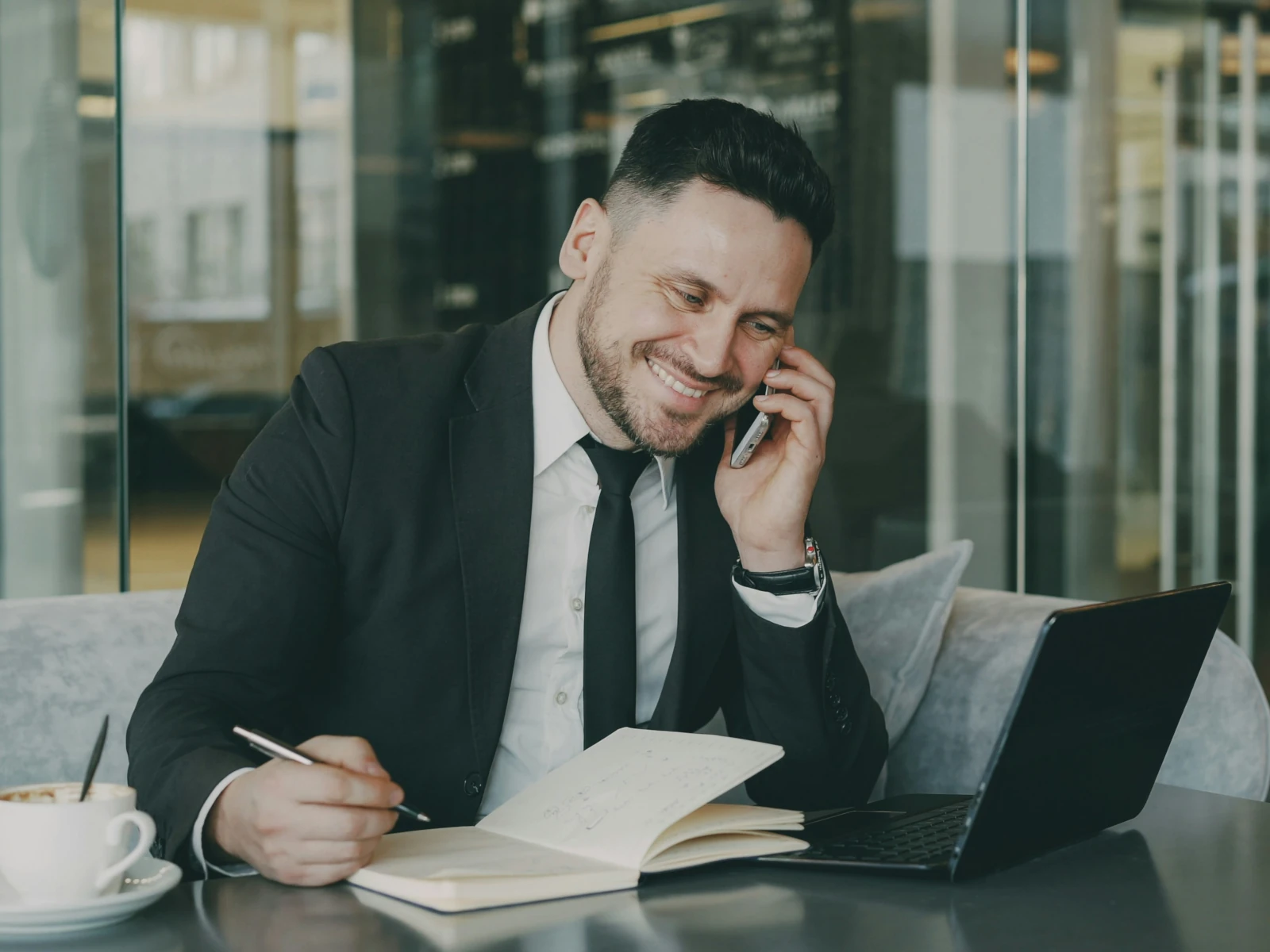a person wearing headphones and sitting at a desk
