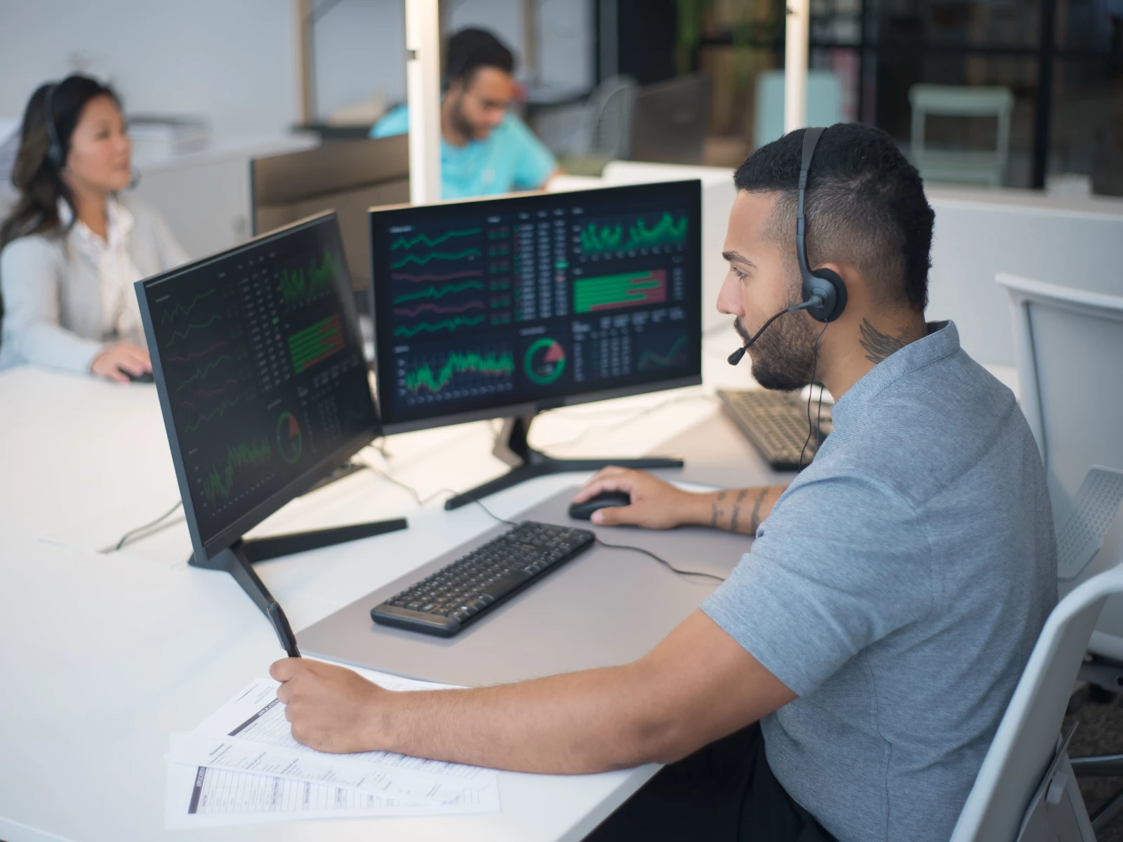 a person sitting at a desk with a computer